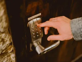 a hand holding a remote control