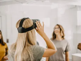 a woman standing in front of a mirror posing for the camera
