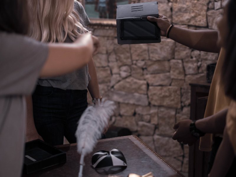 a person standing in front of a brick wall